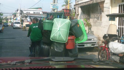 Man-taking-goods-to-sell-on-pedicab